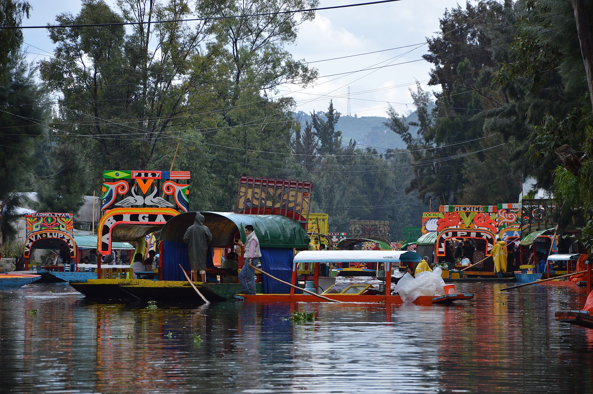 Brightly painted trajinera boats moored along a canal at Xochimilco in Mexico City